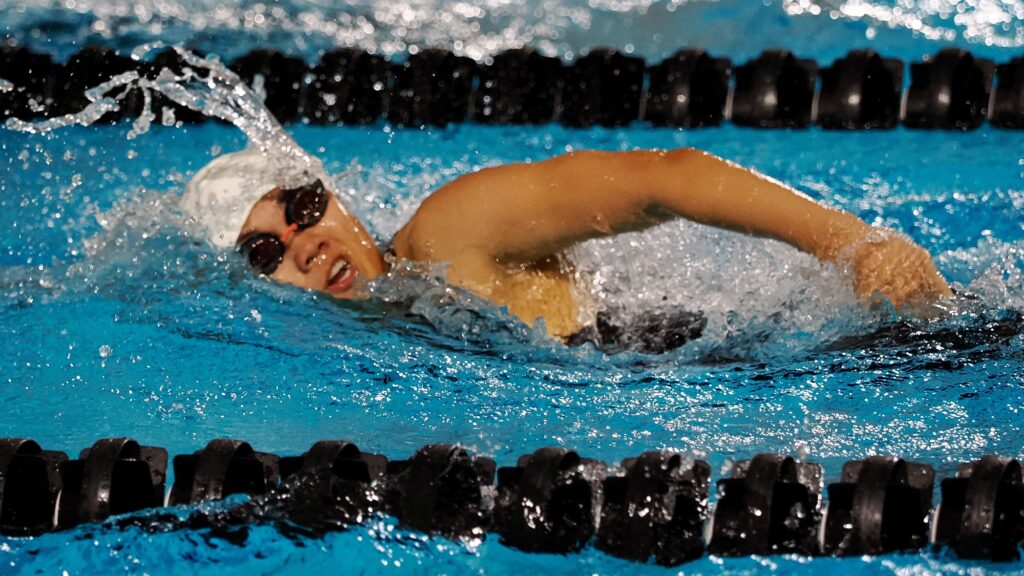 Val Tonnu swims in the pool during a meet for Virginia Military Institute.