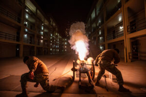 Cadets fire a cannon in barracks to signal the start of Breakout - one of the hallmark events at VMI.