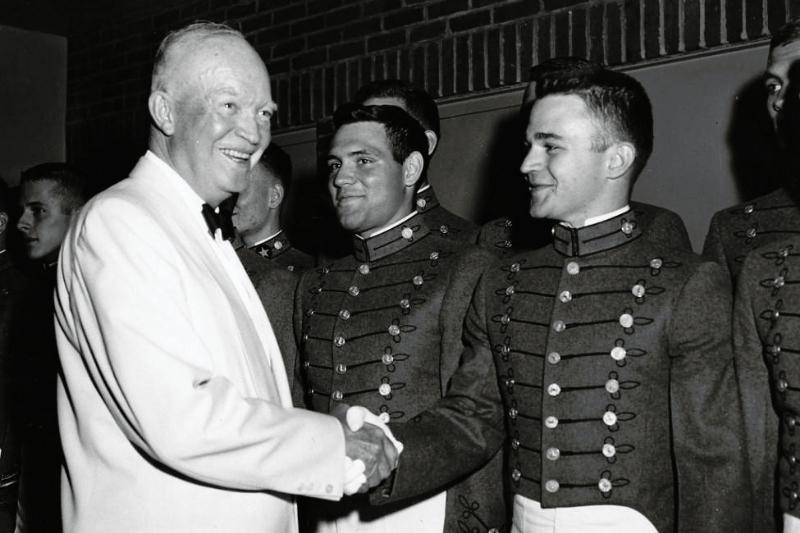 President Dwight D. Eisenhower shakes hands with Cadet Andrew J. Thacker, Class of 1961. The President met with Thacker and other members of the VMI Glee Club after they entertained guests at the Federal Housing Administration Banquet in Washington, D.C. on June 18, 1959.