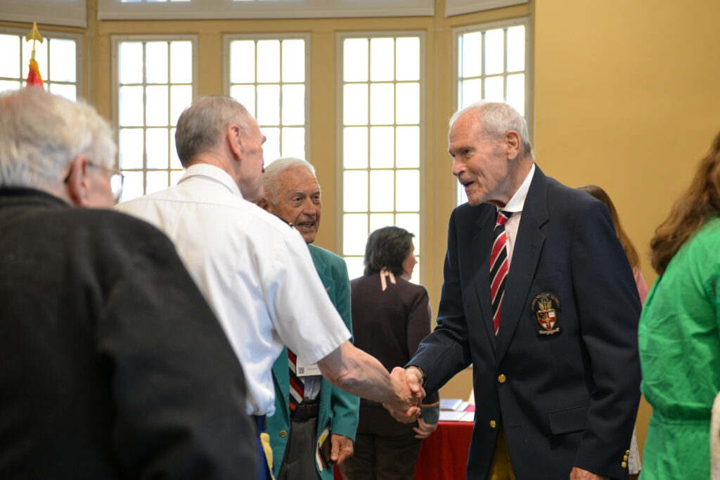  Lt. Gen. Josiah Bunting III ’63 shakes hands with people.