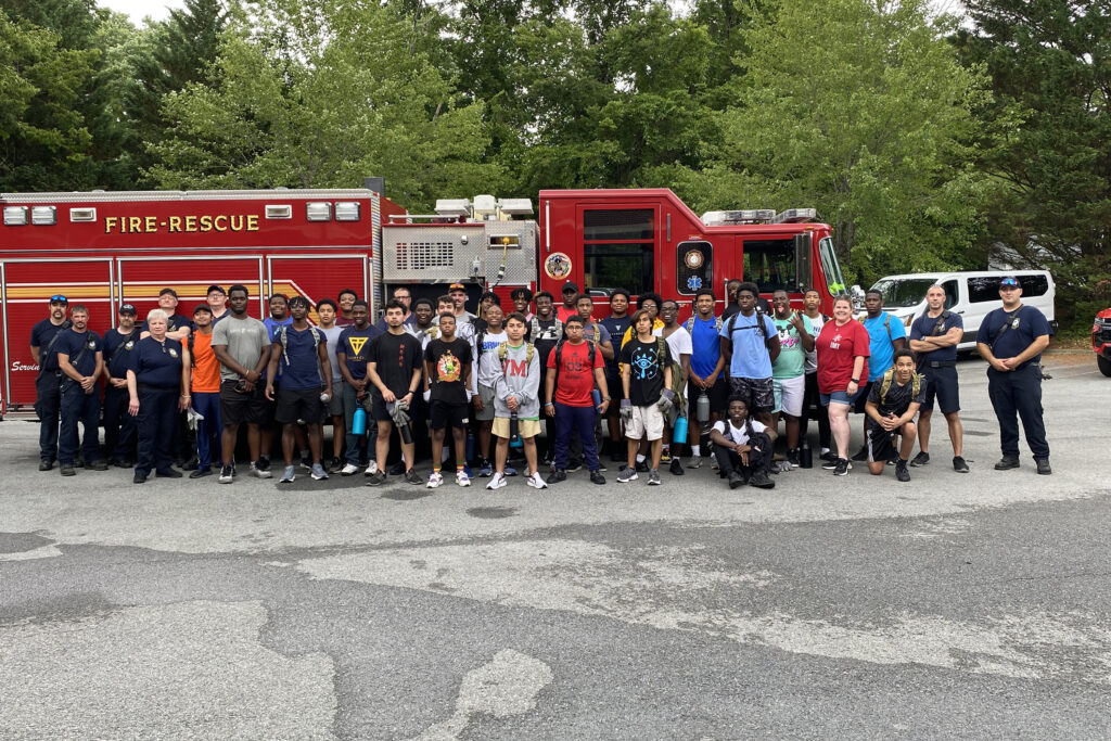 Students in the COW program and Lexington Fire and Rescue after a training.
