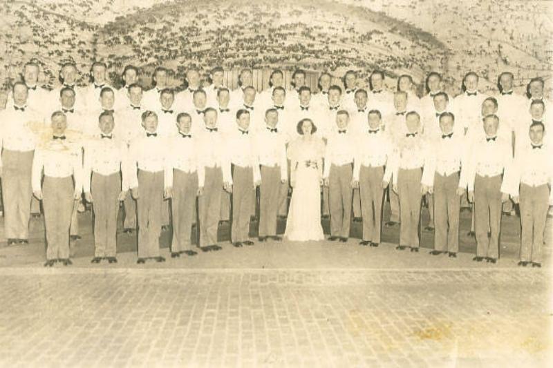 The first organized VMI Glee Club with Director Mrs. Marguerite Ramey. Mrs. Ramey, the wife of faculty member M. G. Ramey, ser. VMI Archives.